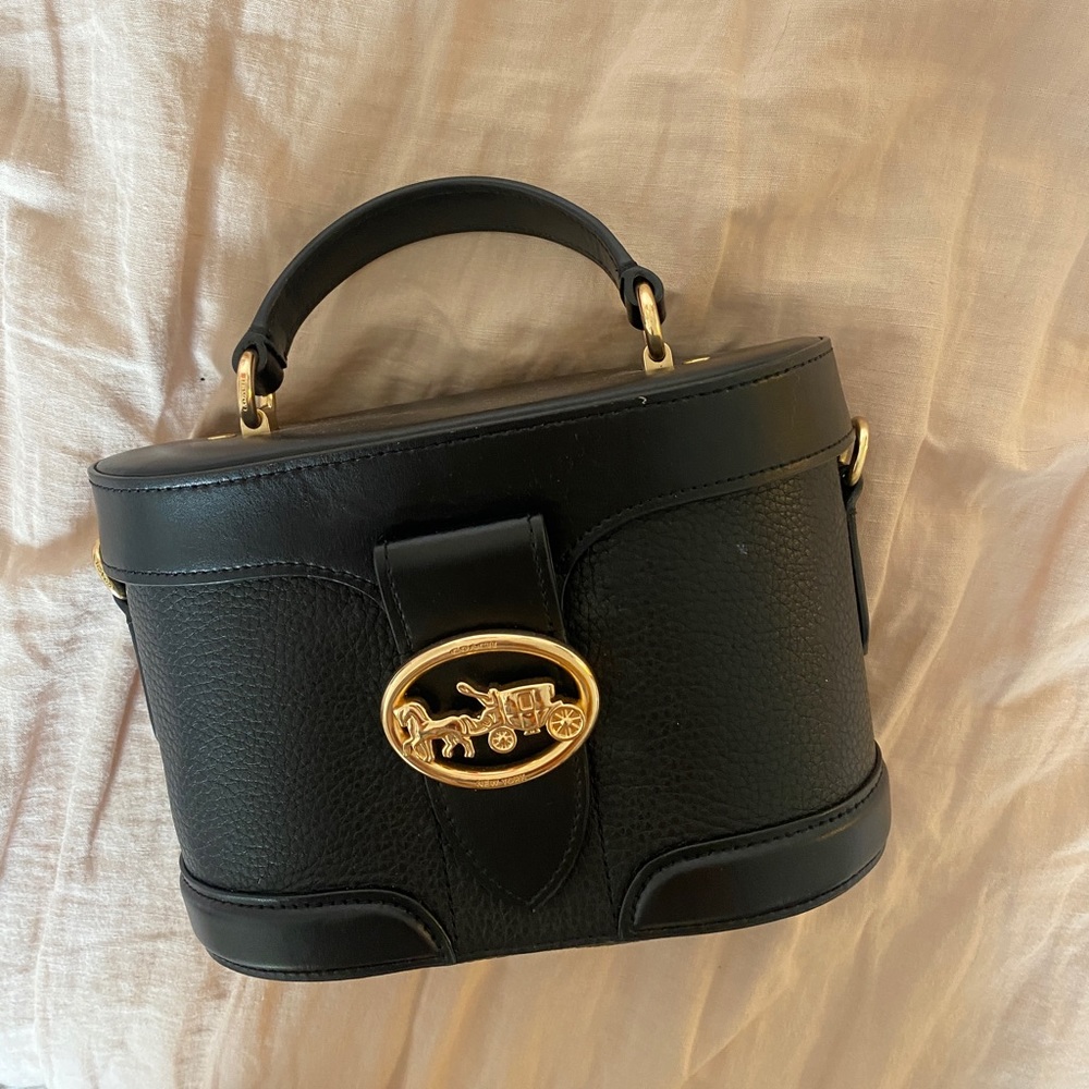 Black coach barrel bag